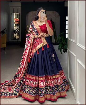 Perfectly Blended Navy Blue Tussar Silk Lehenga Choli with Vibrant Patola Work Dupatta and Tassel Accents