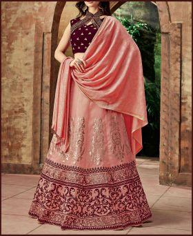 Amazing Peach  Colored Party Wear Silk Embroidered Lehenga 