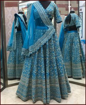 Rich look turquoise malay silk heavy dori embroidered lehenga 