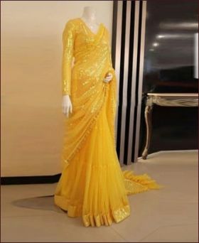 Adorning Sequence Embroidered Soft Ruffle Net Yellow Saree